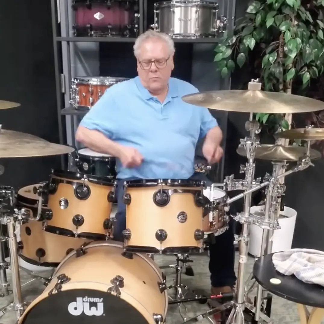 Mario Circelli playing a DW drum kit