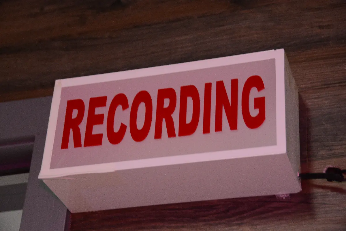 Red "RECORDING" sign on a wall