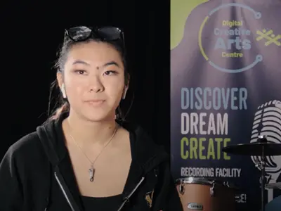 Young woman at Digital Creative Arts Centre, gaining hands-on experience.