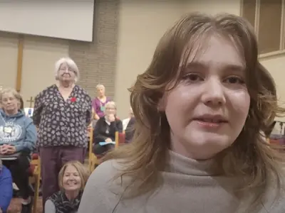 Young woman speaking at a digital creative arts centre.