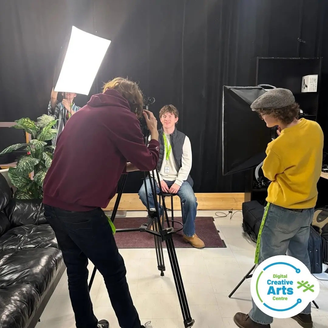 Students filming a co-op placement interview in a studio. Creative industry.