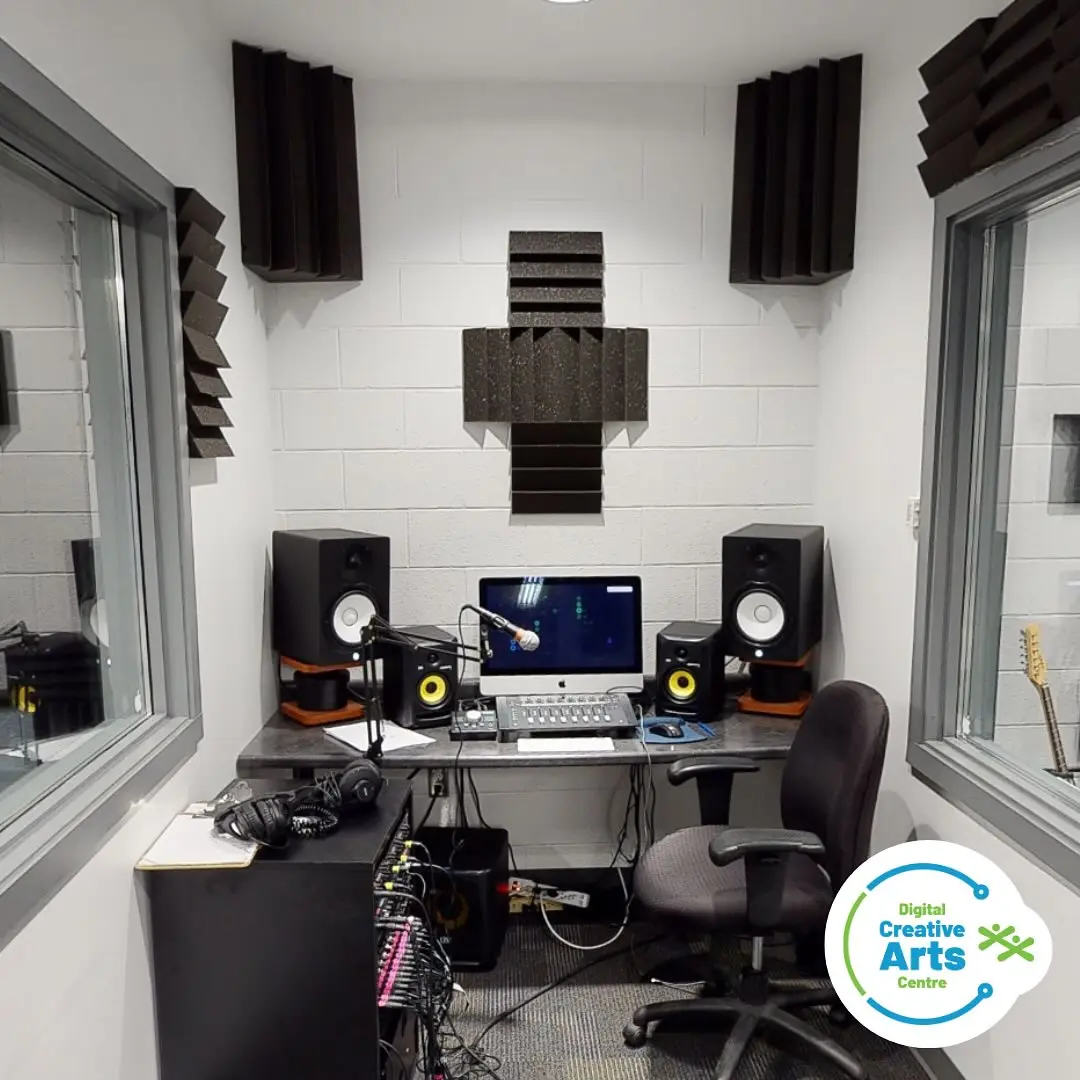 DCAC Recording Studio: Modern recording studio with mixing console, monitors, and sound treatment.