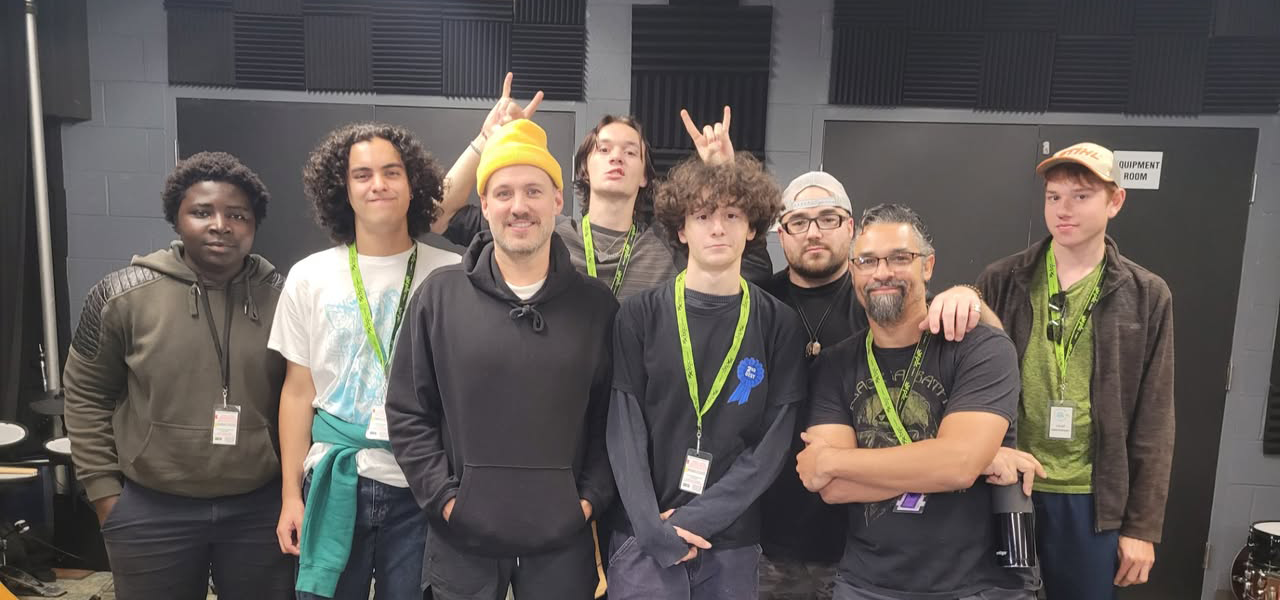 Team photo of Digital Creative Arts Centre London Ontario instructors and students. Celebrating creative careers.