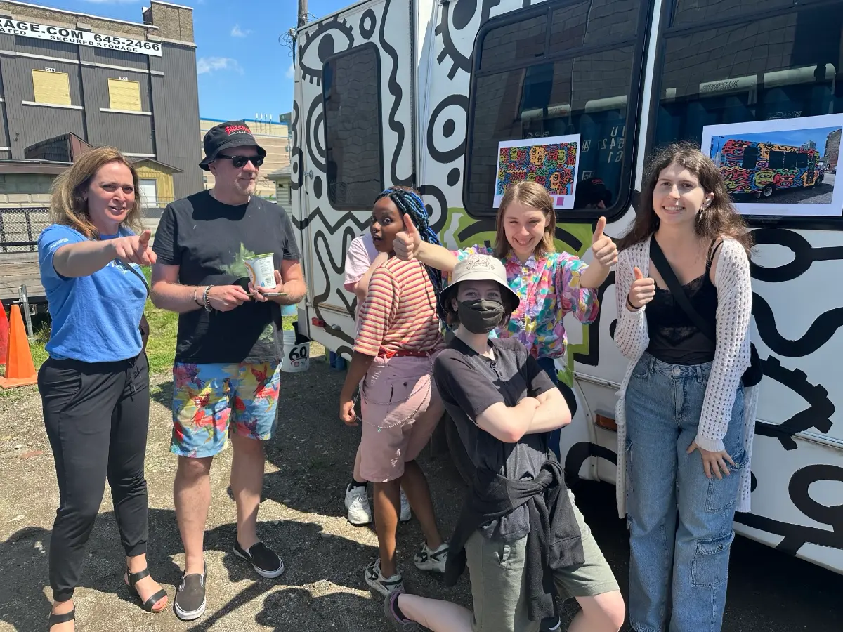 Team of artists at the Digital Creative Arts Centre London Ontario, celebrating a completed project.
